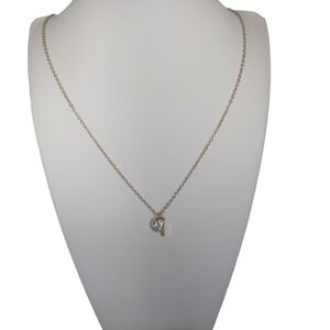 Dainty necklace with a small pendant. Gold costume jewelry